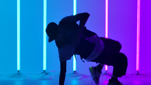 Hip Hop Dancer Performing Freestyle Dance Moves alt