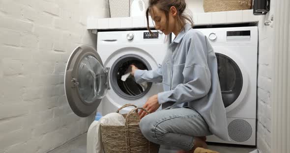 Woman Washing Clothes at Home alt