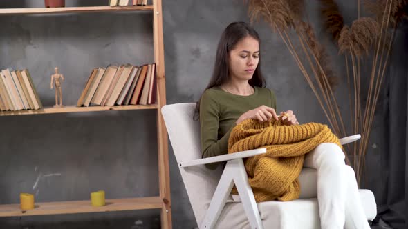 Crochet at Home Young Latin Woman Knitting a Warm Sweater of Woolen Yarn Girl Sitting in a Cozy alt