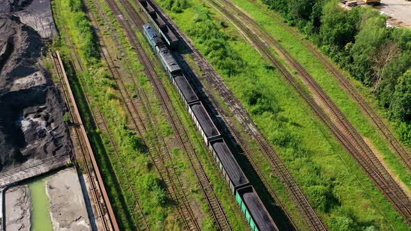 Freight train on the railway. Aerial drone view of freight train alt