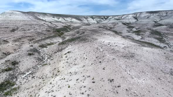 White Limestone Mesa Hill Topography on Plain in Arid Barren Geography alt
