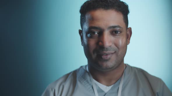 Portrait of Cheerful Middle Eastern Male Doctor alt