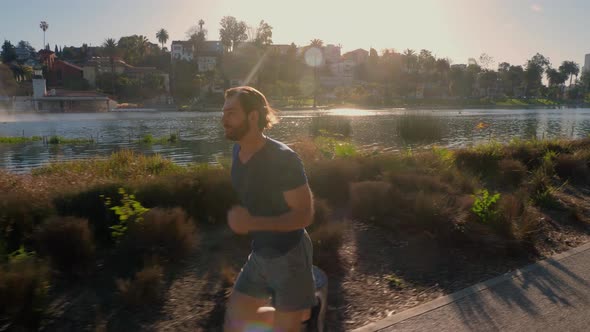 Athletic Man Jogging Around A Small Lake alt