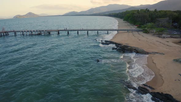 Aerial, Pier And Beach With Tropical Vegetation In Palm Cove, Queensland, Australia