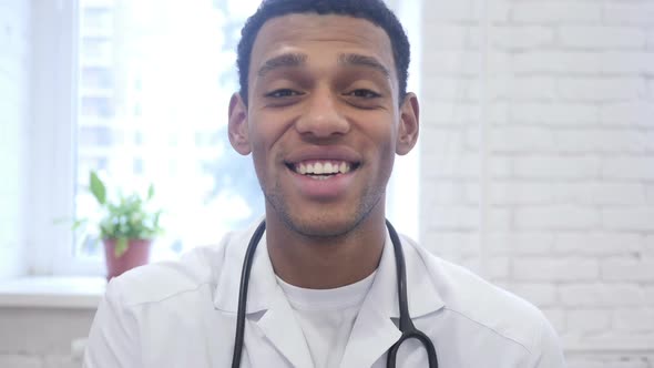 Online Video Chat By African American Doctor Talking with Patient alt