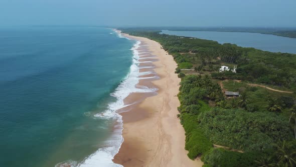 Deserted beach and ocean coast with waves. Wild sandy beach. alt