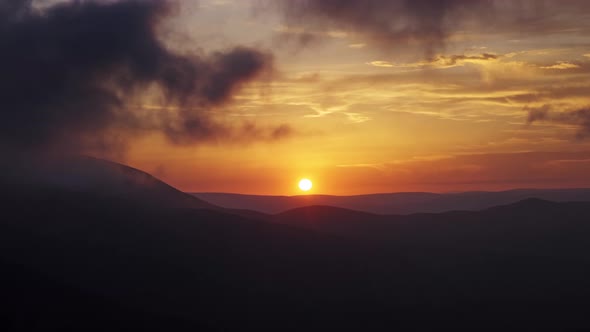 Mountain Dramatic Sunset in Clouds alt