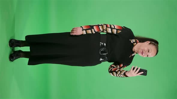 Portrait Elderly Woman Talking on a Video Call Using Her Smartphone alt