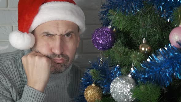 Unhappy Male in Christmas Decorations alt
