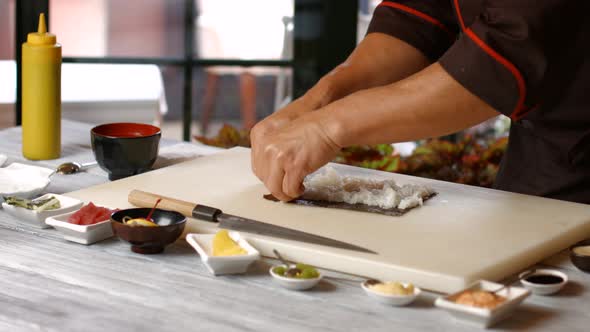 Man's Hands Make Sushi. alt