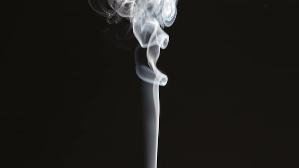 Thin Smoke Stream On Black Background alt