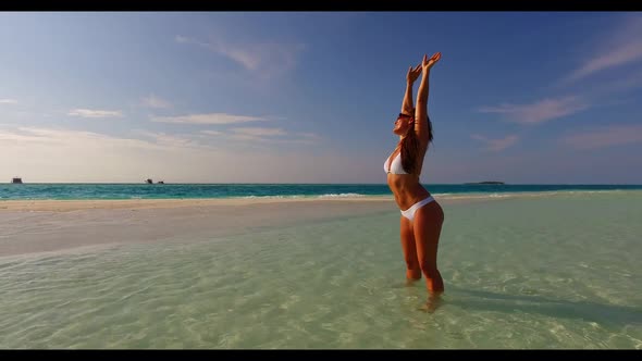 Woman posing on exotic sea view beach break by blue lagoon with white sand background of the Maldive alt