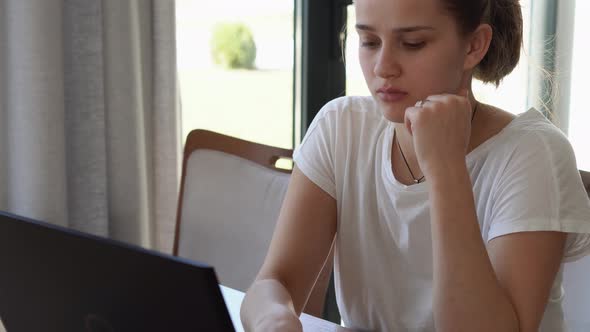 Authentic Caucasian Young Woman Chatting On Laptop At Home In Living Room alt