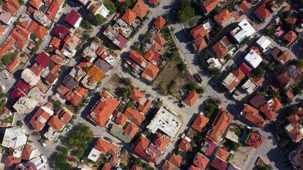 Aerial Drone View of City Buildings with Red Roofs alt