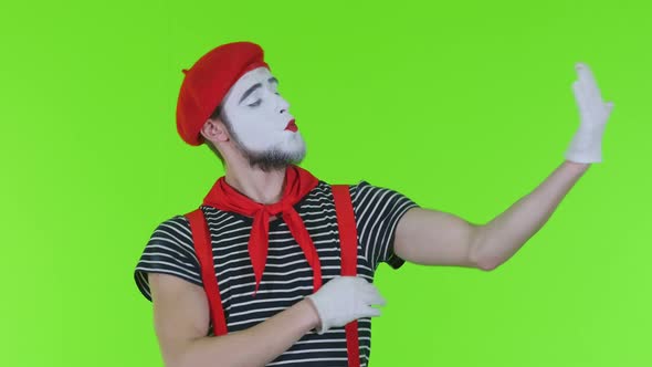 Mime Guy Dresses A Mask On A Green Background