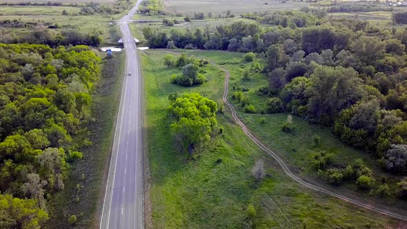 Top View Of Highway With Cars On Green Background alt