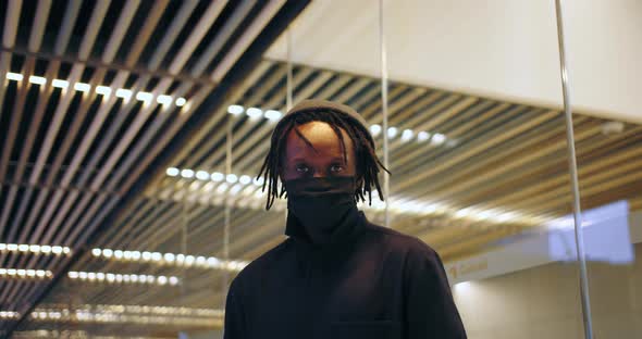 African Young Black Man Wearing Pollution Face Mask Prevention Against Disease in City Urban Setting