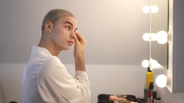 Side View Zoom in Confident LGBT transgender woman Rubbing Cotton Pad in Slow Motion alt