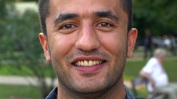 Portrait of a Young Arab Smiling Man alt