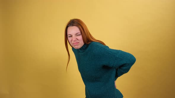 Young Red Hair Woman Posing Isolated on Yellow Color Background Studio alt