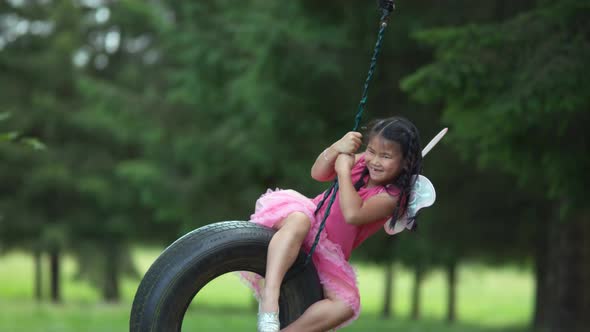 Girl in fairy princess costume on tire swing, shot on Phantom Flex 4K alt