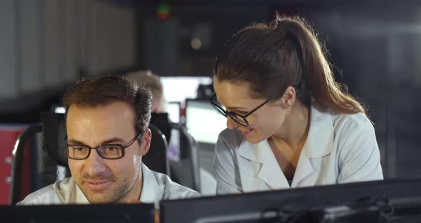 Colleagues Using Computer in Engineering Department alt