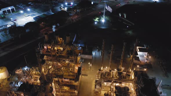 Huge Petroleum Refinery During Its Work at Night. Brightly Illuminated Plant Structures. USA alt