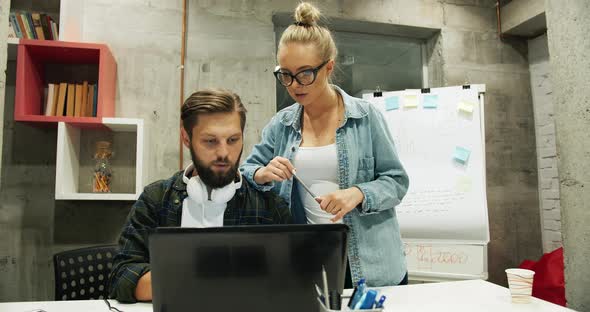 Office Colleagues Working on Laptop