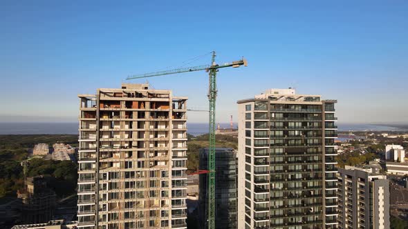 Aerial of tall building construction site and crane in Buenos Aires alt