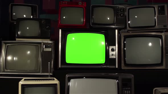 Vintage TV Set with Green Screen Between Many Retro TVs. Dolly In. 4K Version. alt