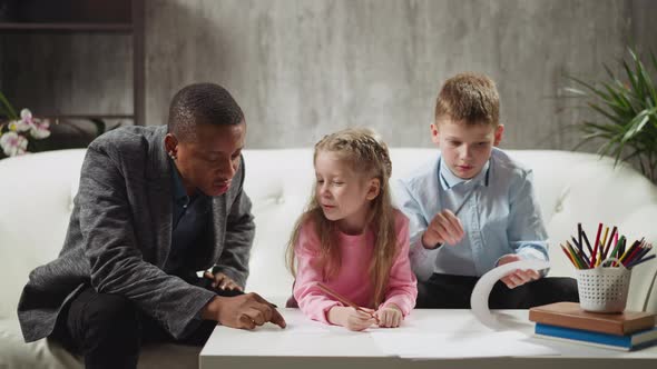 Teacher Writes Word By Finger and Children Try to Guess alt