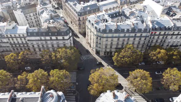 A Drone Flies Over the Roofs of Houses in Paris