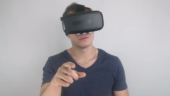 Young Man Browsing Using Vr Headset