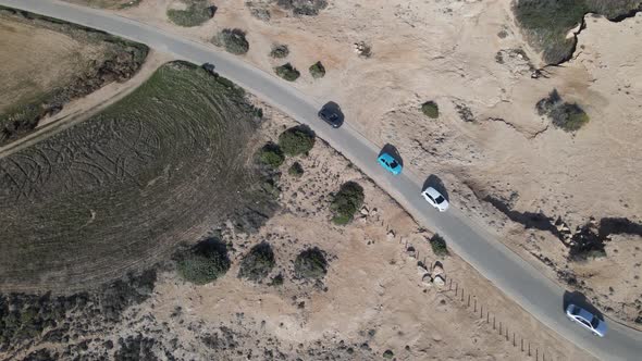 Aerial photography of a car ride against the background of the sea.