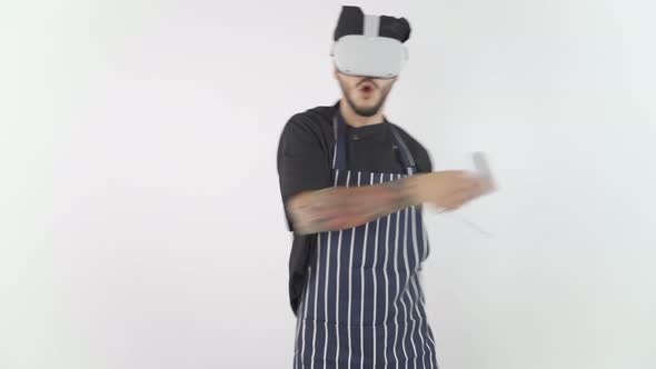 Chef Wearing Virtual Reality Headset Using Controllers Slashing Around Hands alt