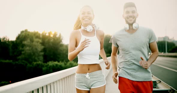 Attractive Man and Beautiful Woman Jogging Together