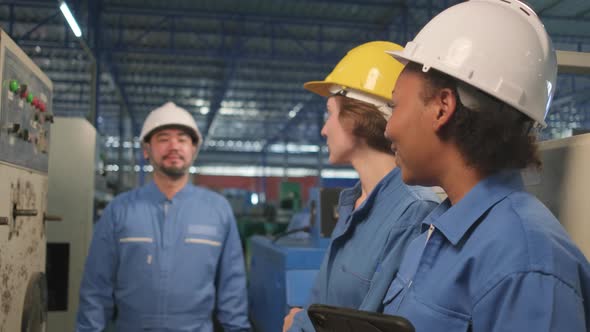 Industry engineer teams inspect machine control panels in manufacturing factory. alt