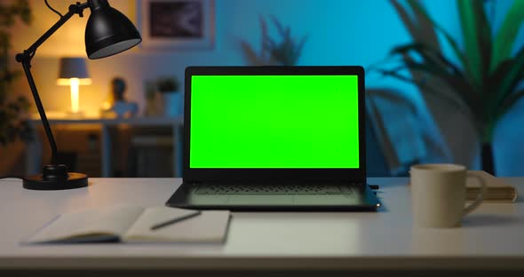 Laptop with Green Mockup Screen