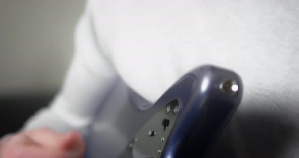 Musician Playing His Music Fingerpicking with His Fingers on the Guitar alt