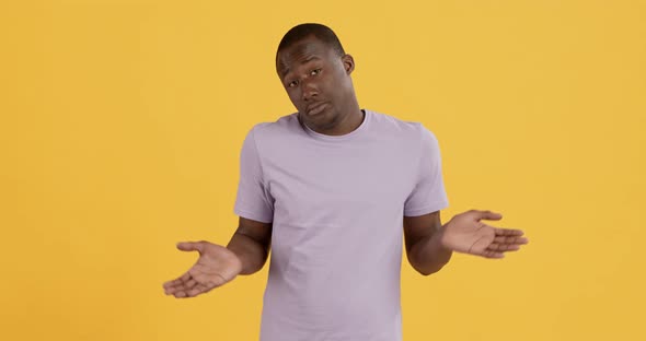 Black Man Raising His Hands and Shrugging Shoulders alt