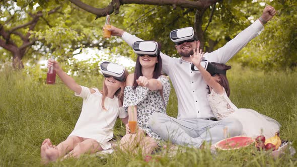 Portrait of Happy Family Using Vr Glasses in Living Room in Slow Motion alt