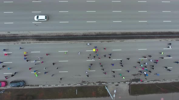 City Marathon Runners Competing on Empty Road alt