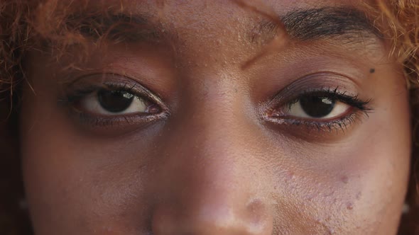 Close Up, African American Black Calm Woman Opening Her Eyes. Meditation and Wellbeing Concept alt