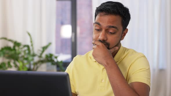 Indian Man with Laptop Working at Home Office alt