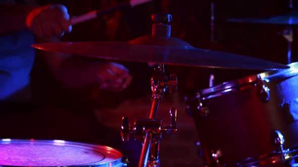 Drummer playing on drum set 4k alt