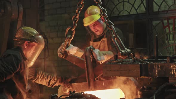 Blacksmiths Working With Heated Steel alt