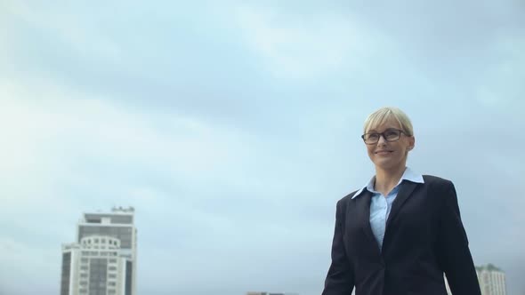 Smiling Woman in Formalwear Walking on Sky Background, Career Promotion, Success