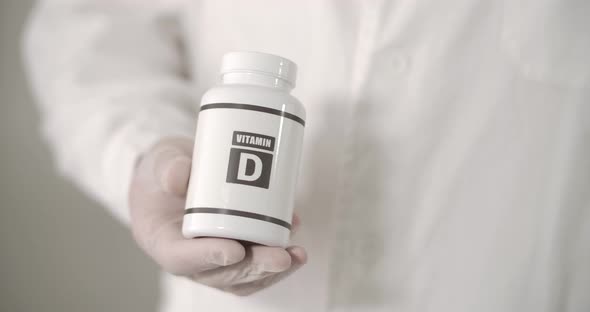 A Big Box of Vitamin D in Doctor's Hand alt