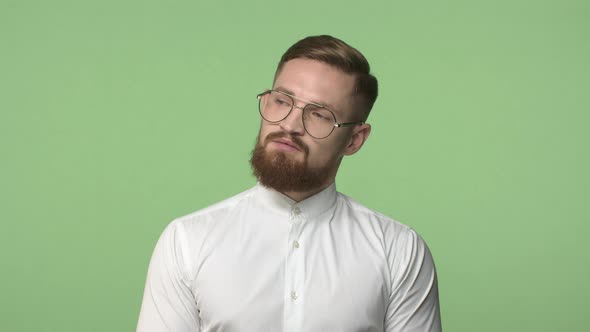 Slowmotion Bossy Seriouslooking Bearded Man Office Manager in Glasses Looking Around with Busy alt