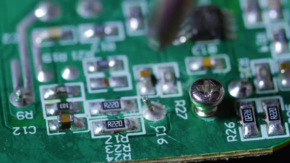 Twisting In Screw On An Electronic Chip Circuit Board